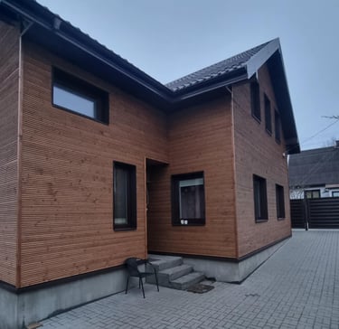 a house with a brick wall and a brick wall