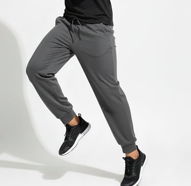 a man in a black shirt and grey pants