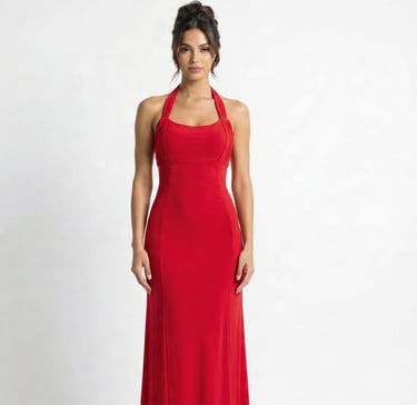 a woman in a red dress standing in front of a white background