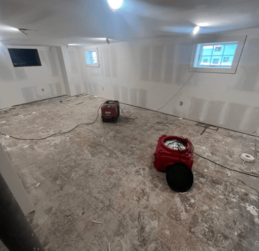 alt="Mold remediation equipment including dehumidifier and HEPA air scrubber in residential home"