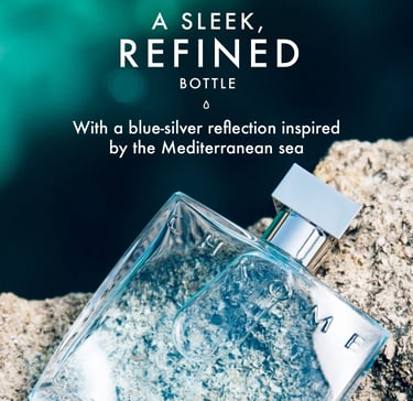 Sleek blue cologne bottle with silver reflection on a rock, inspired by the Mediterranean sea.