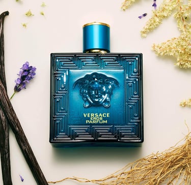Versace Eros Parfum blue bottle surrounded by lavender, vanilla beans, and woody notes.
