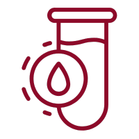 a glass of water with a red liquid inside