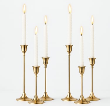 A product photo of six gold metal taper candle holders in varying heights with a white backround