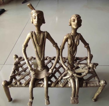 "Brass village family seated on traditional Indian woven cot–handcrafted Bastar tribal art-Export-grade"