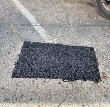 Pothole repair in parking lot