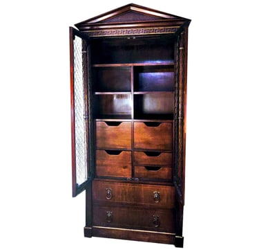 an Empire style wardrobe cabinet with multiple drawers and greek crown at the crest with drawers