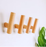 a wooden pegs with four wooden pegs on it