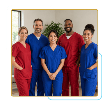 Diverse group of caregivers in scrubs standing together and smiling in a bright, professional setting