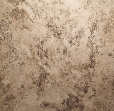 Brown travertine shower wall texture featured in Toledo New Bath bathroom remodel.