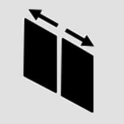 a black and white photo of two doors with arrows pointing up