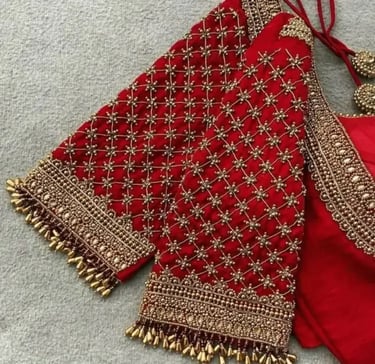 a red blouse with gold and silver beads and a red and gold blouse