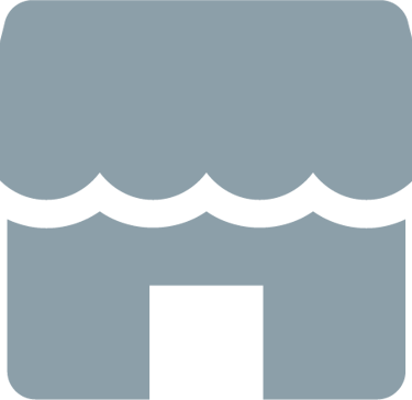 Icono gris de una fachada comercial que representa un negocio local con toldo festoneado y entrada.