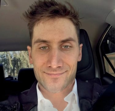 a man in a suit and tie is smiling