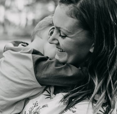 a woman holding a child in her arms