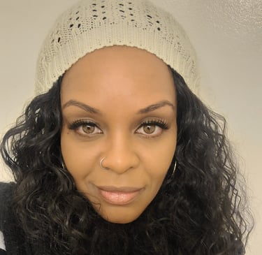 a happy woman with a white hat and a black scarf