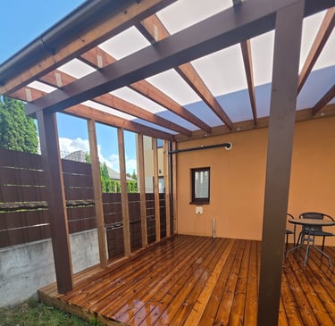 a wooden deck with a table and chairs