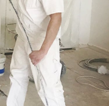 painter painting a wall