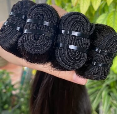 Close-up of machine weft bone straight Vietnamese hair with strong stitching