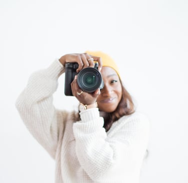 Portrait of Shade holding a camera