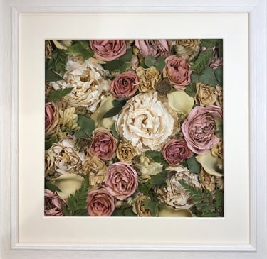 a Flower Wall Style bouquet of flowers in a ridged white frame