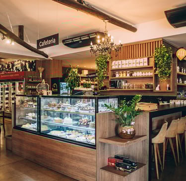two people toasting wine glasses with food