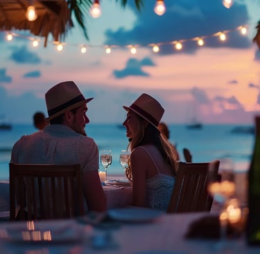Romantic beachfront dinner in the Dominican Republic with wine, candlelight, and Caribbean sunset views