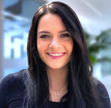 a woman with long hair and a black top