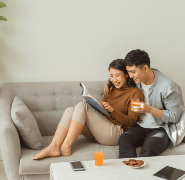 a man and woman sitting on a couch connecting through quality time