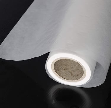 a roll of white paper with a roll of tissue paper