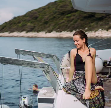 a sugar mommy sitting on a boat in the water