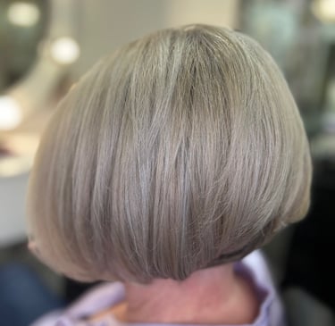 a woman with a short blonde bobble haircut