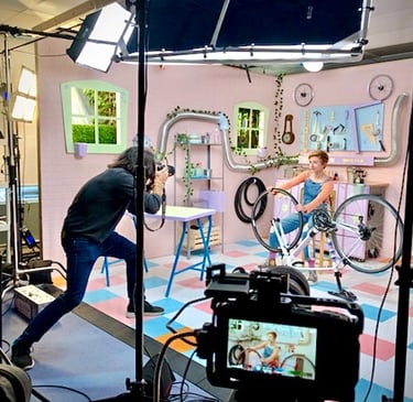Production of a colourful kids’ show set with bright props and playful decorations