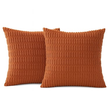 A digital image of two square rust-colored corduroy pillow covers with visible texture