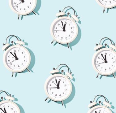 a bunch of clocks on a blue background