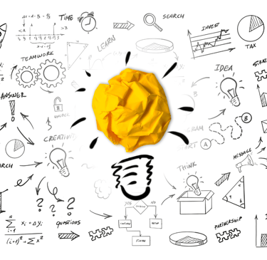 a yellow crumpled paper ball with a light bulb inside