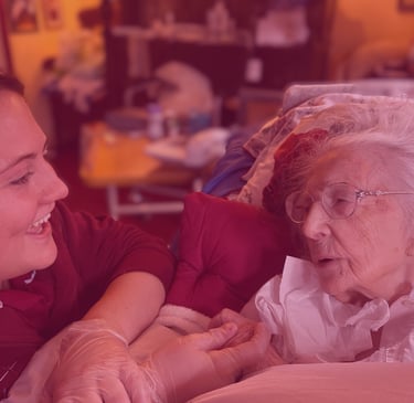 Image of an AMG nurse talking and caring for a patient