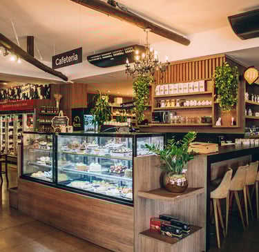 two people toasting wine glasses with food