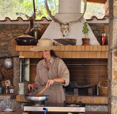woman cooking traditional food in greek farmhouse
