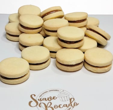 a bunch of cookies and a cupcake on a table