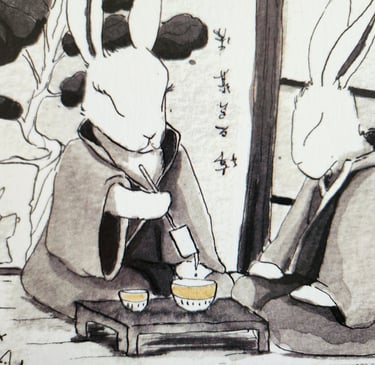 deux lapins japonais qui prennent le thé
