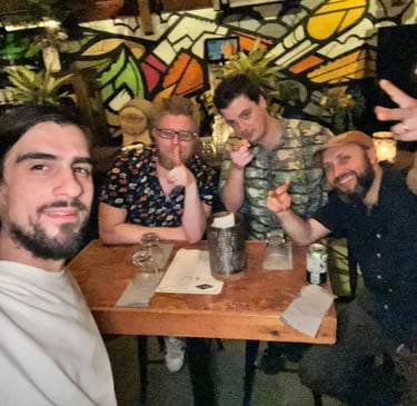 a group photo of four men