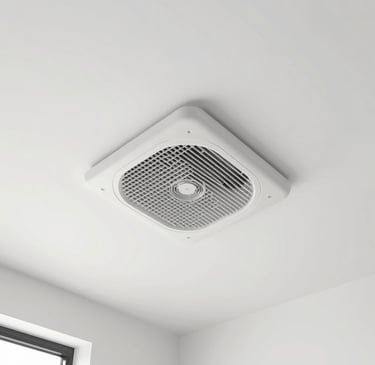 An outdoor air source heat pump unit installed on a white wall of a modern residential home.