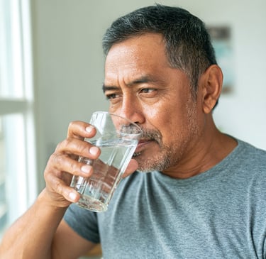 Man drinking water for healthy hair