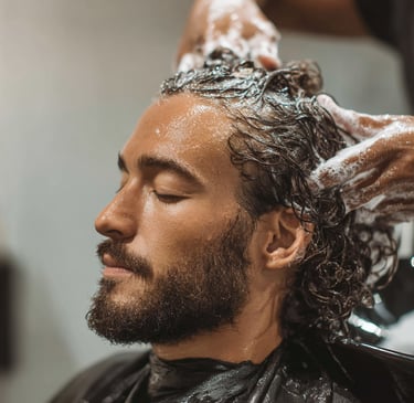 Washing hair Claudios Hair Salon