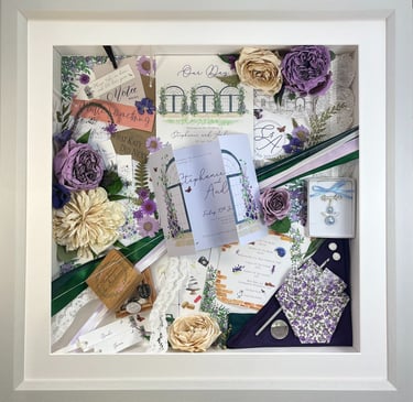 a Memory Box frame featuring wedding keepsakes and flowers