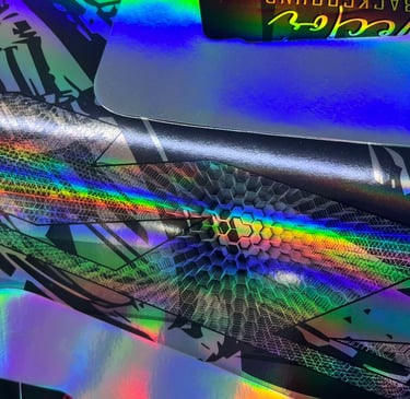 a close up of a colorfully colored skateboard