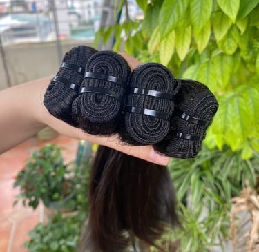 Close-up of machine weft bone straight Vietnamese hair with strong stitching