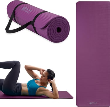a woman is doing a yoga mat with a yoga mat