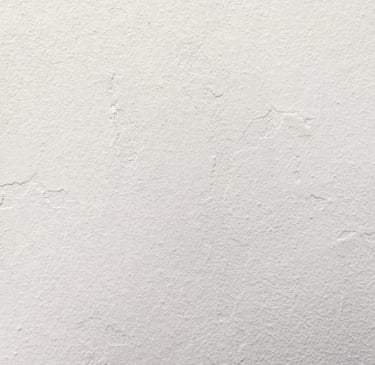 ¨Plâtre - Minimalist white plaster wall texture with subtle concrete surface imperfections.